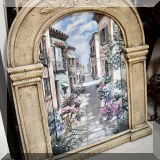 A21. Street scene print in arched frame. 